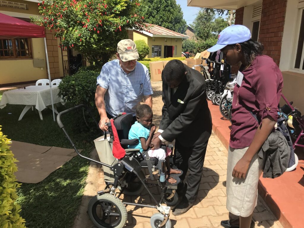 child getting fitted for his wheelchair