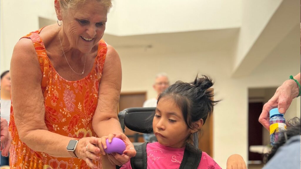 Girl receiving her new wheelchair